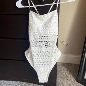 Size Medium one piece swimsuit with cutouts.